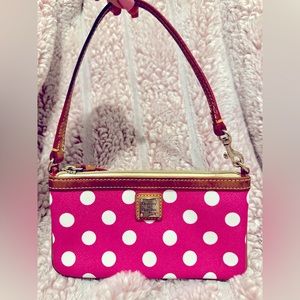 Dooney & Bourke small pink polka dot wristlet with red interior